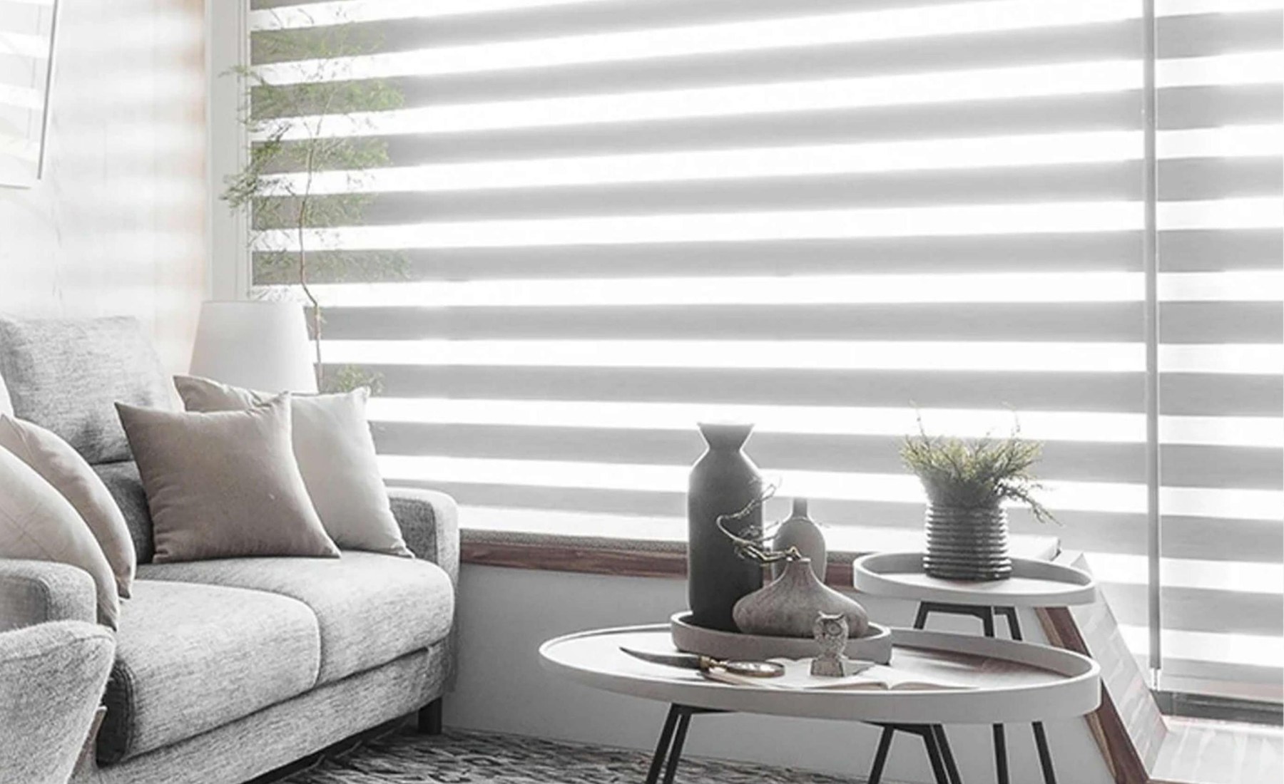 Evercurtain motorized zebra shades in a bright modern living room
